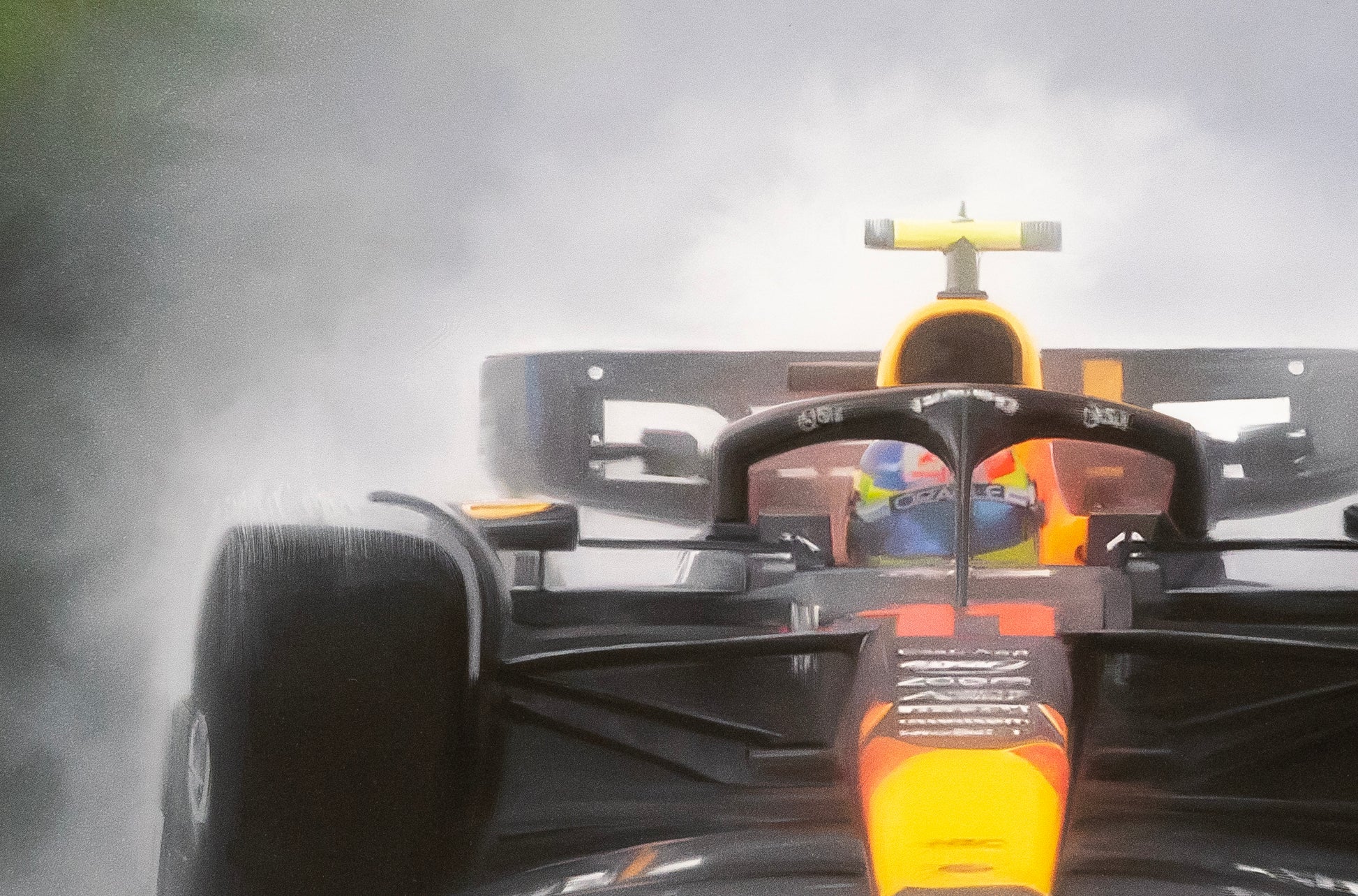 Max Verstappen driving the Red Bull Racing F1 car to victory in the rain in the  Belgian Grand Prix.