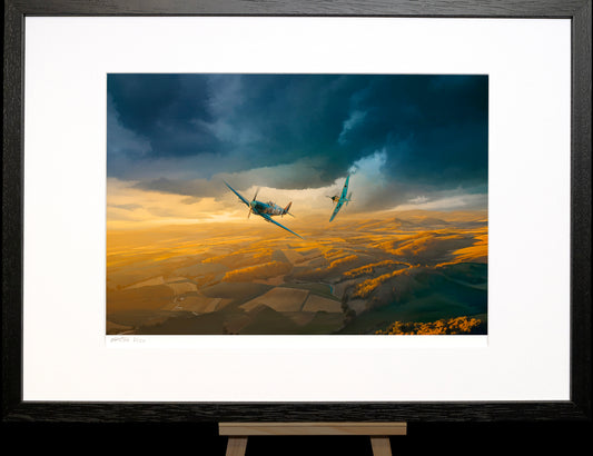 Two airplanes flying over a landscape with a stormy sky